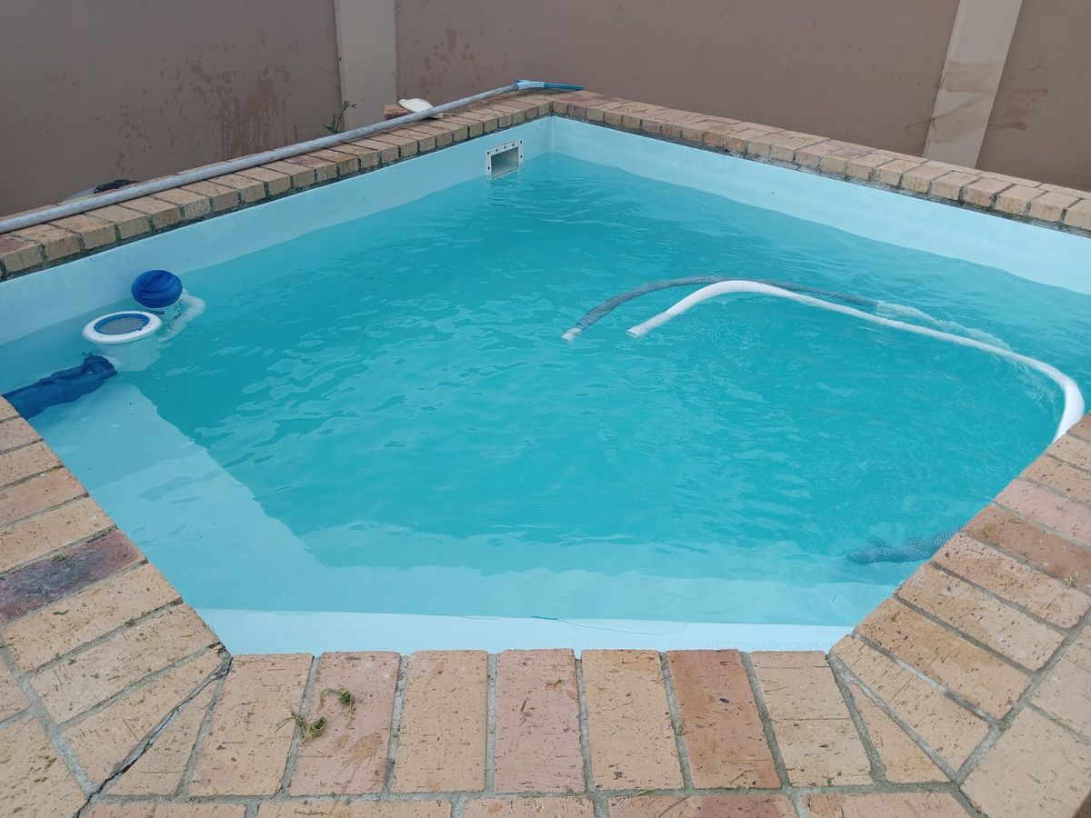 The same pool after The Pool Crew renovation, with clean blue water