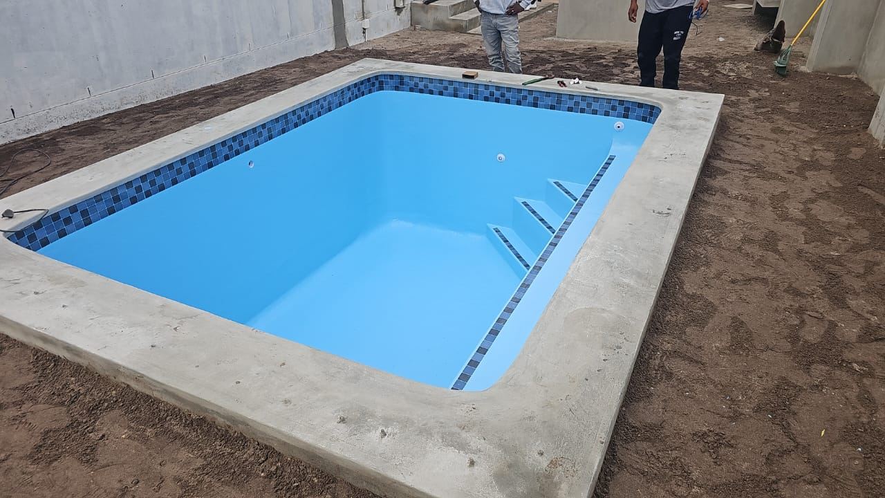 Newly built pool with tiled steps, freshly filled