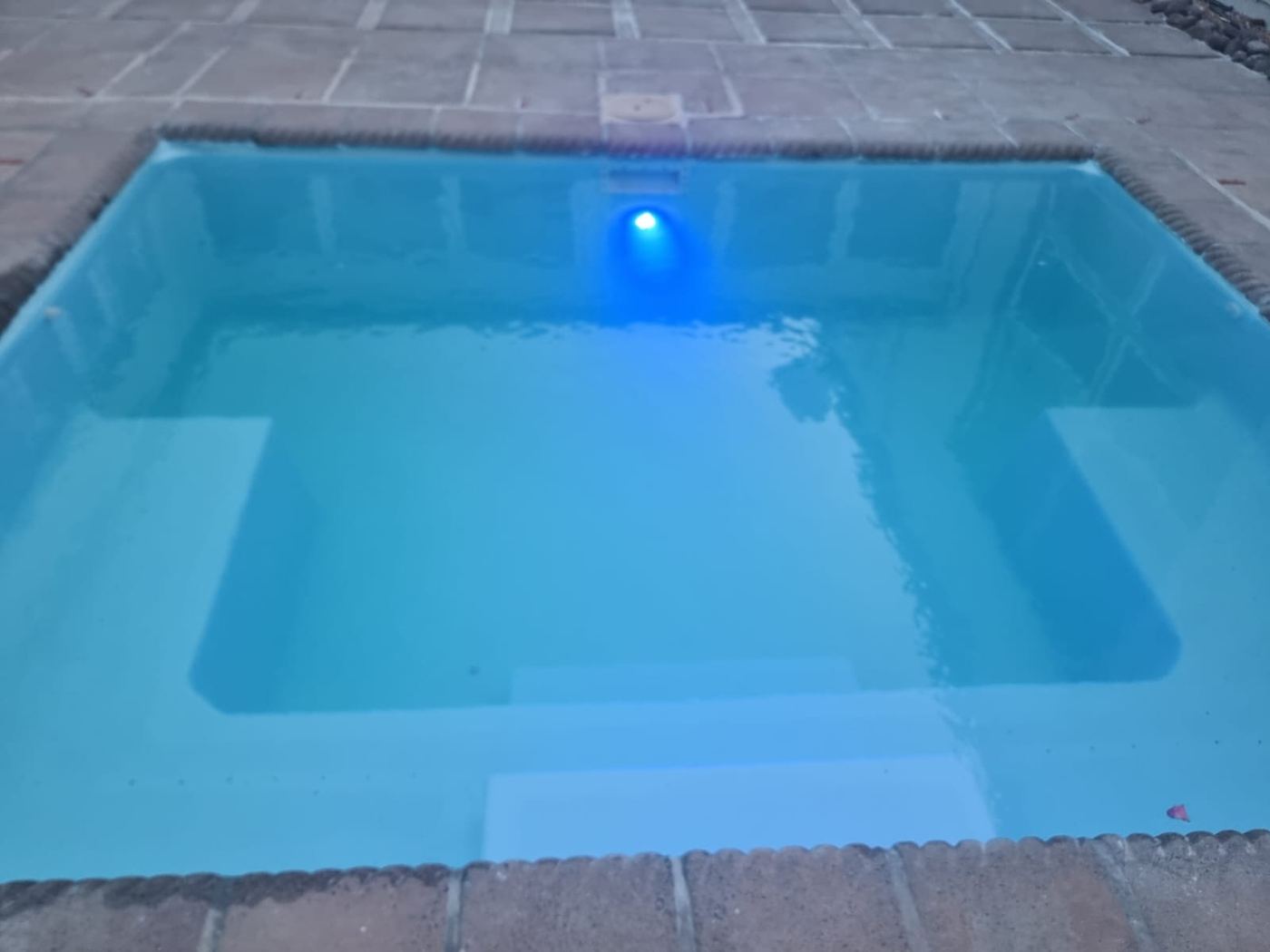 Plunge pool at dusk with a new LED pool light